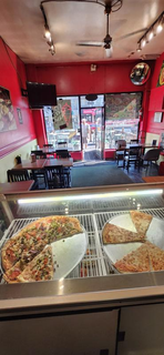 For Sale: 24-year-old pizzeria located on a very active street with 30+ chairs.