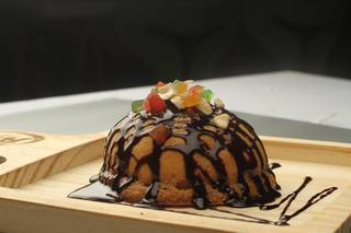 Cafe serving baked stuff buns located in a mall and has given out 10 franchisees.