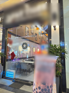 Franchise café for sale with 30-seat capacity, attracting around 40 daily walk-in customers.