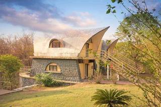 Adventure resort spanning 20 acres in Kolad, featuring accommodations, conference halls, 18 thrilling adventure activities.