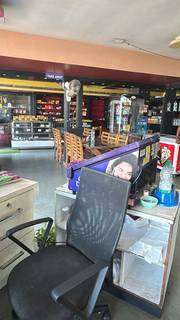 Established Kerala restaurant and bakery with full equipment, available for long-term lease on highway-facing site.