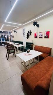 Premium cafe close to Infopark, with aesthetic interior and full kitchen equipment including grill machines.