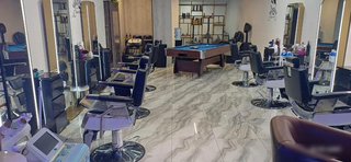 Thriving barbershop with a fully furnished setup, 4 skilled staff and 8-month valid trade license.