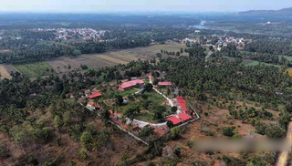 Wellness retreat near Mysore featuring diverse therapies and accommodation options, available for complete sale.