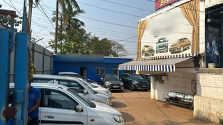 Used car dealer selling 35 cars per month seeking loan to start a new outlet.