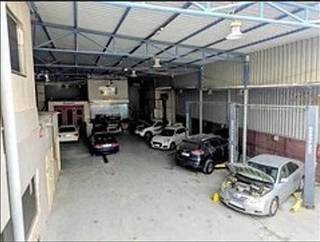 Auto garage facility servicing sedans, LCVs, and HCVs with fleet contracts and 100+ monthly customers.