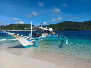 For Sale: Ecotourism business in Palawan, the Philippines, including a passenger boat and vehicle.