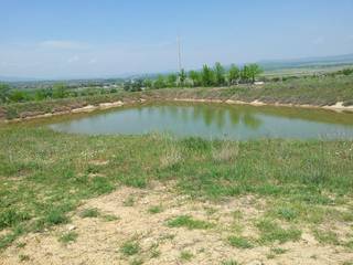 Land measuring 3.5 hectares with mineral water lake, 2 windmills, and 6 wells for sale.
