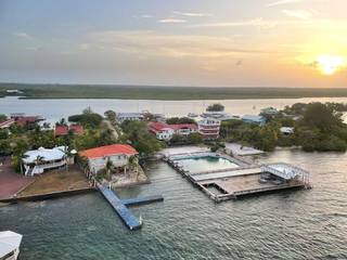 Turnkey 24-unit resort with dive center, offered for sale with operational licenses and full setup.