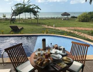 Luxury beachfront guesthouse in Brazil's tourism hotspot with 85% occupancy during peak seasons.