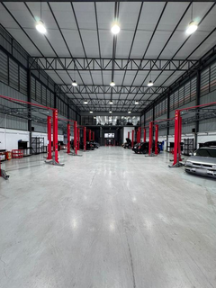 Bangkok automotive service center with modern workshop infrastructure offered for sale due to management constraints.