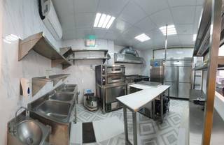 Fully equipped turnkey cloud kitchen in Sharjah with established delivery brands available for sale.