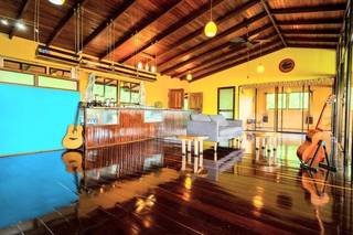 Non-operational nature-view Caribbean restaurant and treehouse event venue at Nauyaca Waterfalls, with expansion opportunities.