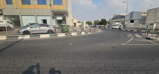 Restaurant business visible at a commercial location with a vehicle parking space.