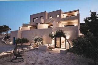 Boutique hotel with real estate in Milos, Greece, offered for full sale with expansion potential.