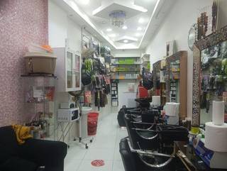 Luxurious beauty destination for women offering hair, nail, and spa services.
