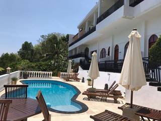 Luxury private villa with 9 room and 1 suite operating with 90% occupancy rate.