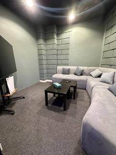 Gaming lounge with PlayStation 5, board games, and private rooms, catering to 700+ clients monthly.