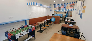 Cafe in Ahmedabad surrounded by universities with 20-25 seating and specializes in milkshakes.