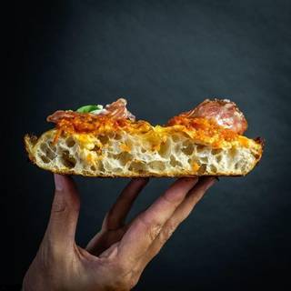 Scalable plant-based artisanal pizza chain seeking partial stake sale for expansion with proven track record.