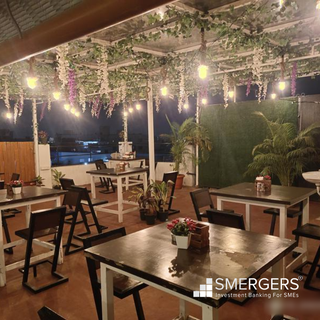 Rooftop two-floor multi-cuisine cafe with seating capacity of 70 and 30 - 40 daily walk-ins.