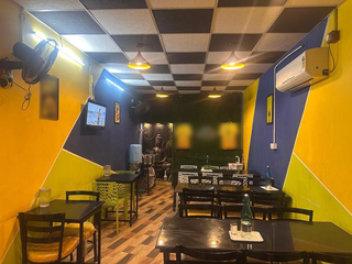 Restaurant serving South Indian and Chinese cuisine with rooftop dining, party facilities, and FSSAI licensing.
