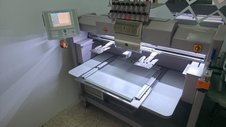 Custom embroidery and engraving business for sale with established customer base and partnerships.