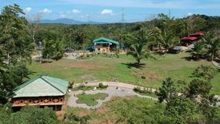 Integrated farm with livestock, operating as TESDA farm school and DOT farm tourism site.