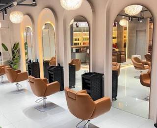 Unisex salon offering affordable beauty services, achieving break-even within three months and building regular clientele.