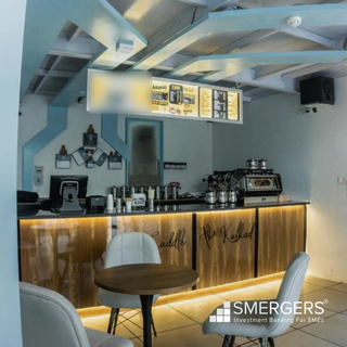Franchise cafe outlet in Gurgaon in corporate building receives 250 visits/day is for sale.