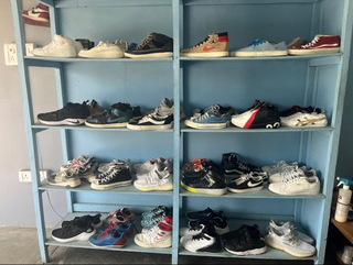 An apparel store in Imphal, India, with 10,000+ customers, seeks a loan.