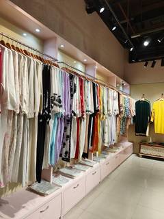 Complete boutique store fit-out assets for women’s apparel, including racks, trial-room fixtures, and cash counter.