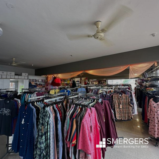 Clothing retail shop with premium brands and 20-30 daily walk-ins receiving ~INR 2,000 per order.