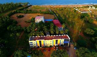 A beachside Pondicherry resort with steady customer flow and spa, lodging, boarding service for sale.