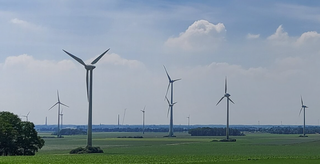 Company investing in renewable energy, seeking business loans for wind farms and locker-box investments.