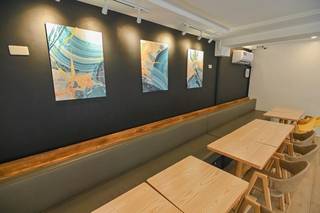 Hybrid bar serving coffee and cocktails with seating for 38 & 1,200 guests/month seeks funds.