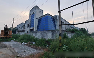 Industrial property with 50,000 sq. ft. built-up area available for manufacturing, office, or rental use.