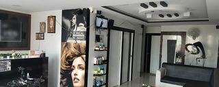 Well established unisex salon offering haircuts, grooming, and skincare services, serving 10-12 customers daily.