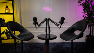 Fully equipped podcast and content production studio setup with acoustically treated space and professional equipment.