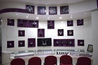 Gold and diamond jewelry showroom in Coimbatore with in-house manufacturing facility.