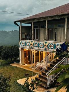 Agri-tourism retreat offering lodging, events, and village experiences for tourists and expats seeking tranquility.