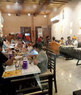 Vegetarian restaurant near Indra Market with strong walk-in and online orders, registered with FSSAI/GST certifications.