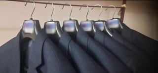 Partial stake sale in a uniform design firm targeting new markets and in-house production.
