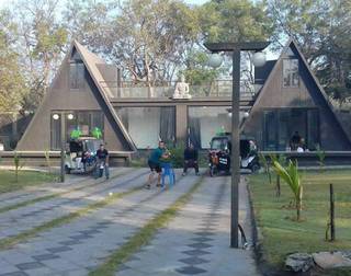 Resort in anand with 42 luxury rooms and adventure park, receiving 300 guests per month.