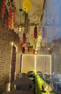 Cafe in New Delhi with diverse cuisine, 32-seater capacity, and steady footfall.