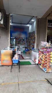 For sale: Newly opened Kirana shop that has taken up a franchise for milk products.