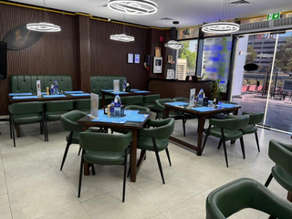 For sale: North-Indian and desi Chinese restaurant with canal-view, indoor and outdoor seating in Dubai.
