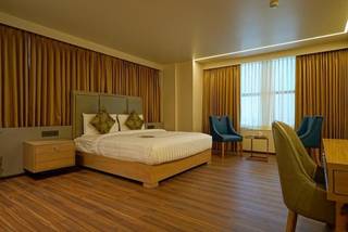 For sale: Four-star hotel in Rajkot offering accommodation, dining, banquets, meetings, and leisure facilities.