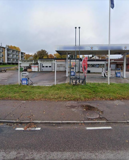 Debt-free Swedish gas station property with four shops, currently closed and available for restart.