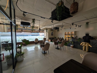 Premium café and event hub with a 40-seat capacity, delivering 30+ community events each month.